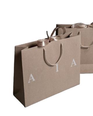 China Modern Wholesale Eco Friendly Custom Logo And Printed Brown Kraft Paper Bag for sale