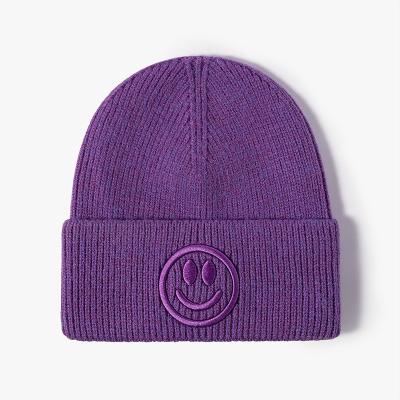 China COMMON Good Quality New Winter Fashionable Children's Warm Knitted Hat Candy Colors Cute Smiley Face Wool Hat Beanie Knitted Hats For Kids for sale