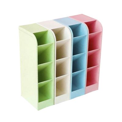 China Transparent multi-grid pen stand plastic oblique storage box storage pen holder to collect cosmetic pen holder for sale