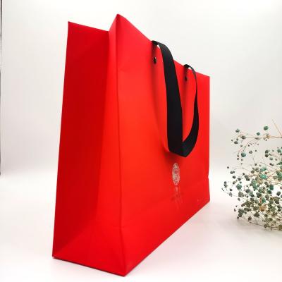 China Custom Recycled Materials Factory Logo Boutique Tote Bag Paper Bag Shopping Gift Bag With Ribbon Handle for sale