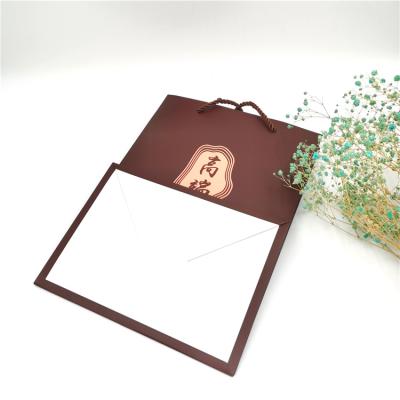 China Recyclable Custom Gift Bag Factory Logo Luxury Paper Bag Three Strand Rope Handle Handle for sale