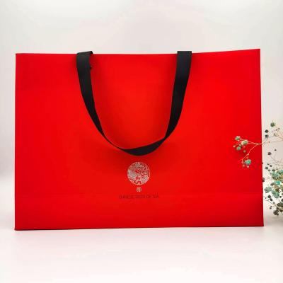 China Recycled Materials Tote Bag Paper Bag Shopping Gift Custom Paper Bag With Ribbon Handle for sale