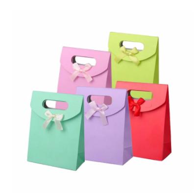 China Recyclable Gift Bag Colored Handle Hand Paper Packaging Pouch With Cover Lid Paper Package Bags With Ribbon Bow Christmas Wedding Gift for sale