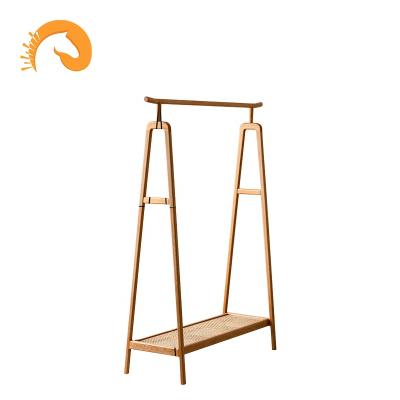 China Eco-friendly Nordic Solid Wood Floor Clothes Rack Japanese Style Bedroom Household Rattan Clothes Rack for sale