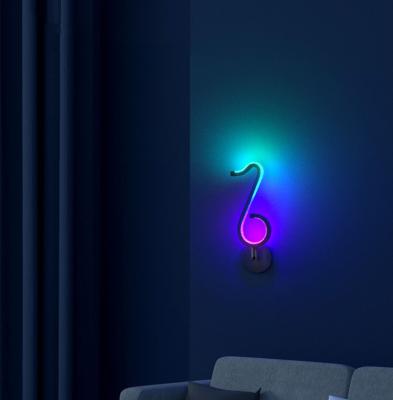 China Modern Minimalist RGB Music LED Note Table Lamps Modern Home Decor Luxury Colorful Bedroom Bedside Lamp for sale