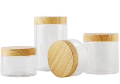 China Cosmetic Clear Plastic Storage Jar Empty Refillable With Bamboo Cap for sale