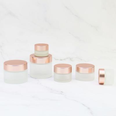 China Skin Care Pink Clear Frosted Cosmetic Glass Jars With Rose Gold Lid 5g 10g 30g 50g for sale