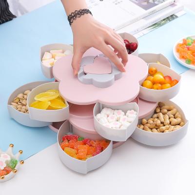 China Sustainable Petal-shape Fruit Snacks Candy Food Plastic Two Layers Double Color Spinning Storage Box for sale