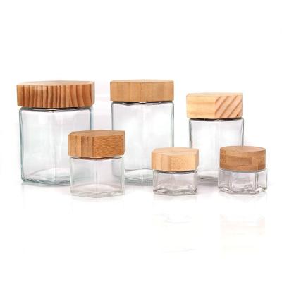 China 70ml 180ml 280ml 380ml Honey Empty Hexagonal Food Storage Preservation Glass Jar With Wooden Lid for sale