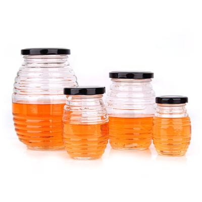 China Wholesale viable 100ml 180ml 380ml 730ml threaded bee shape glass honey jar containers with screw lid for sale