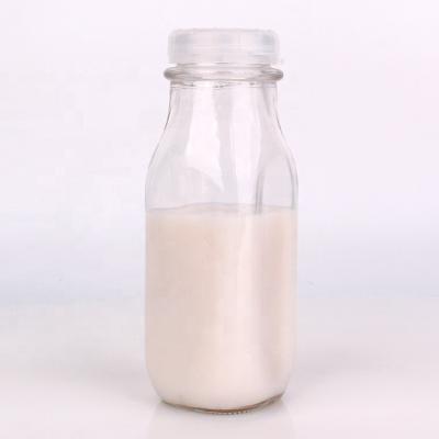 China Clear Square Beverage 240ml 8oz Glass Bottles Milk Vintage Style With Cap For Coffee Tea Juice for sale