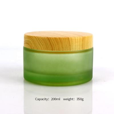 China Empty Green Frosted Glass Cosmetic Jar 200ml Skin Care Face Cream Cream Jar With Cap for sale