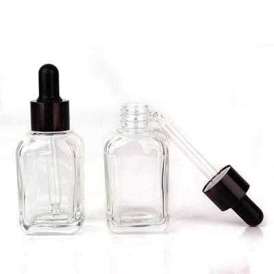 China Custom Flat Square Empty Cosmetic Glass Bottles Eco-friendly 1oz Dropper Bottles With 30ml Eye Dropper for sale