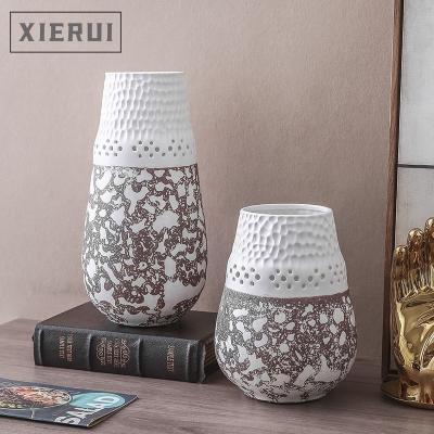 China 2021 Minimalist Luxury Home Decor Creative Hollow Wedding Flower Vase Bud Minimalist Black And White Ceramic Vases For Home Decor for sale