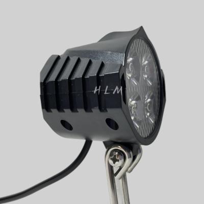 China Low Beam and Horn HLM Waterproof Electric Bicycle Front Light Bike Accessories LED Bicycle Light with Horn and Speaker for sale