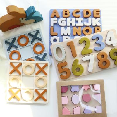 Cina Ingrosso Puzzle XO in silicone personalizzato Logo Brand Bambino Puzzle di silicone didattico in vendita