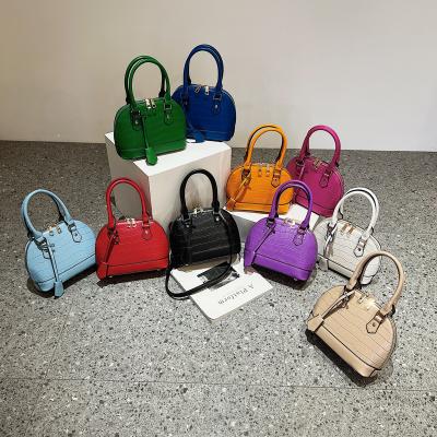 China PORTABLE Hot Sale Candy Colors Small Handbags Young Ladies Small Shell Handbag Trendy Cute Purse For Girls for sale