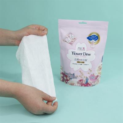 China Coin Magic Compressed Towel Disposable Natural Rose Extract Pure Dew With Compressed Dry Towel for sale