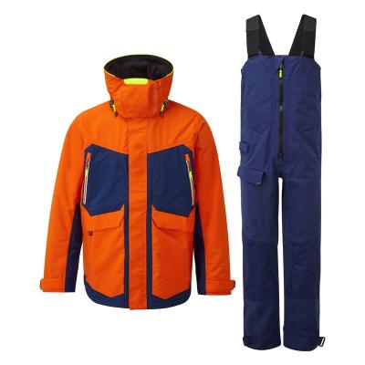 China Breathable orange waterproof offshore jacket and pants fully taped seams fishing set for sailing adventure for sale