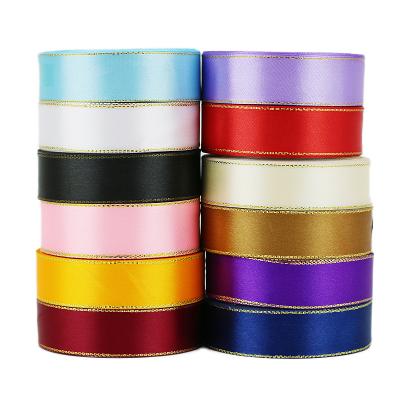 China Wholesale High Quality Tenacity Gift Wrapping Ribbon Roll (25 yards/roll) 25mm White Gold High Edge Satin Ribbon for sale