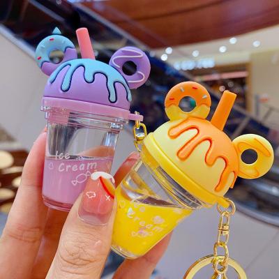 China Promotion Gift Cute Cartoon Lilangda Sequin Quicksand Keychains Liquid Keychain Lady Backpack Pendant Donut Milk Teacup Dangle Keychain for sale