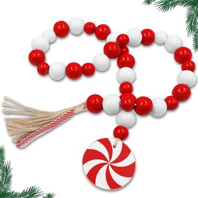 China Wooden Bead Garland Farmhouse Rustic Beads with Jute Winter Red and White Sugar Holiday Slice Peppermint Tassles for sale