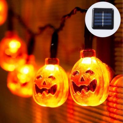 China 7m Pumpkin Solar Sunlight 50LED 8 Modes Orange Pumpkin With Flashing Face Decor String Smile Lights For Halloween Christmas Holiday Party for sale