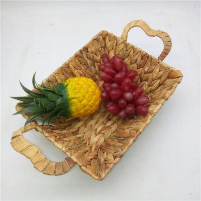 China Sustainable Hot Sale Amazon Straw Sea Grass Fruit Tray Round Handwoven Storage Baskets Water Hyacinth Food Storage With Handle for sale