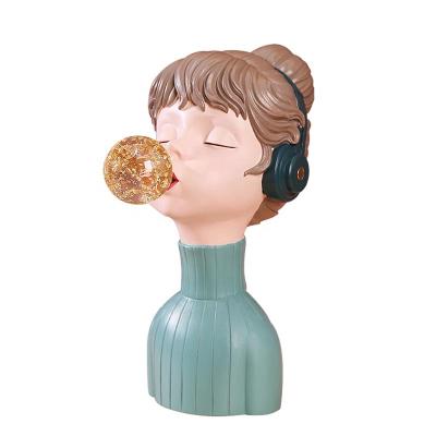 China Europe simple desktop cartoon new creative and fashionable decoration resin crafts girl listening to music for sale