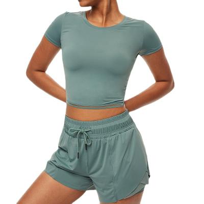 China Feel Sports Breathable Quick Dry Naked Workout Clothes Set Of Women Fitness Cropped Tops And Shorts Yoga Wear for sale