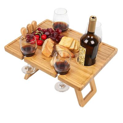 China Huayi Modern Bamboo Wooden Foldable Food Table Serving Picnic Table with Wine Rack for sale