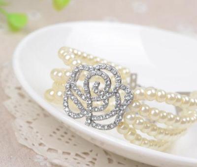 China Hot Sale Women's Jewelry Fashion Diamond Rose Elastic Bracelet Four-Layer Pearl Bracelet for sale