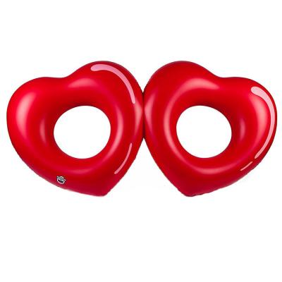 China Outdoor Activities Inflatable Love Twins Swimming Ring Couples Love Float PVC EN71 Custom Heart Swim Ring for sale