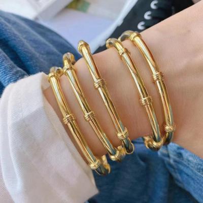 China Simple Hiphop Bangle Women Gold Twisted Cuff Bracelet Bangle Twist Bracelet For Women Jewelry for sale