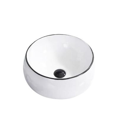 China Modern Hot Sale Ceramic Art Hand Wash Basin Countertop Round Basin Sink Hotel Bathroom Basin for sale