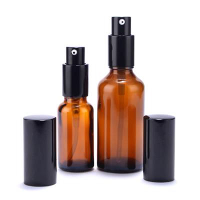 China 10ml 15ml 20ml 30ml 50ml Cosmetic Eco-Friendly Amber Color Oil Container Hair Oil Lotion Pump Bottle Skin Care Glass Packaging for sale