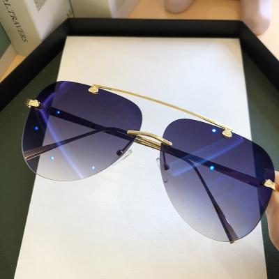 China Vintage Fashion Oval Metal Rimless Sunglasses For Men Gradient Sun Glasses for sale