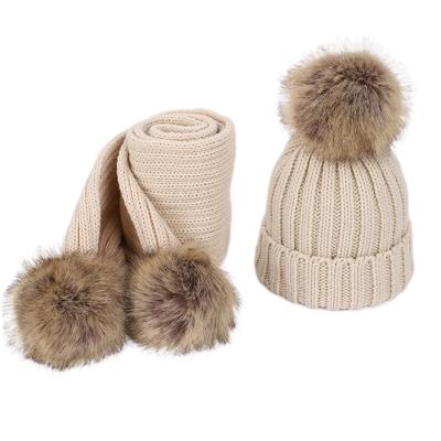 China Middle Baby Knitted Pompom Beanie Winter Hats And Scarf Set With Faux Fur Flip Pom Boys Girls Kids for sale