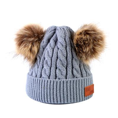 China COMMON Warm Products Winter Cable Knit Warm Pom Winter Hat For Babies for sale