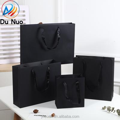 China Recyclable Wholesale Black Paper Bag With Handle Customized Shopping Bag Recyclable Shoes Clothes Packaging Printed Logo Gift Bag for sale