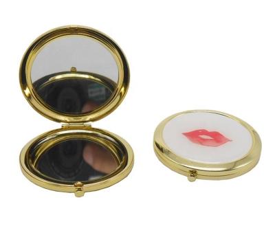 China Double sided metal pocket mirror with red lip for sale