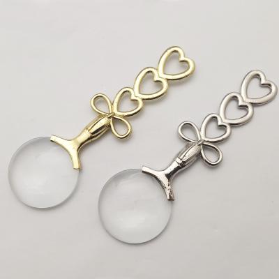 China Novelty Home Reading Gold and Silver Metal Decorative Heart and Arc Handle Magnifying Glass for sale