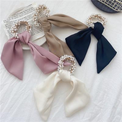 China Hot Selling Fashion Pearl Ribbon Scarf Silk Scrunchies Silk Bowknot Elastic Hair Gather Hair Rope For Women Girls Ponytail Holders for sale