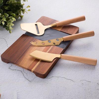 China NEW viable design for 3pcs blade cheese knife set with gold coating on the blade for sale