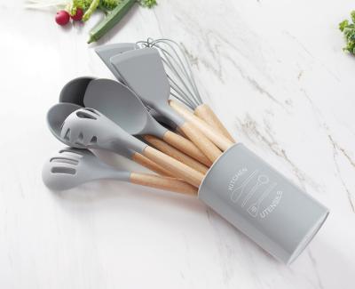 China Amazon Viable 12 Piece Wooden Handle Silicone Kitchenware Set Non Stick Pot Spoon Spatula Colander Kitchen Utensils for sale