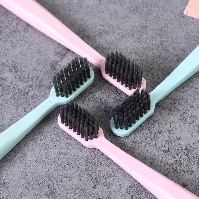 China New cheap and high quality disposable PLA 100% biodegradable toothbrush with soft rubber for sale