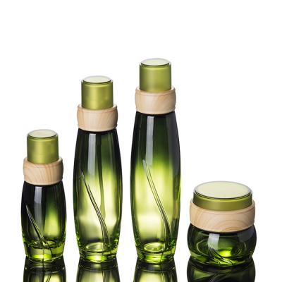 China Luxury Green Gradient 120ml Glass Bottle With Inner Stopper For Essential Water for sale