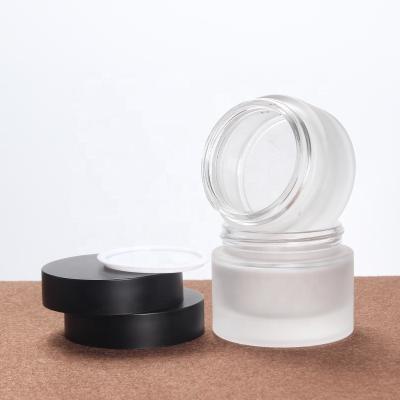 China LOW MOQ Factory Price 50g Eco-friendly Glass Empty Black Cap Frosted Glass Cosmetics Cream Jars for sale