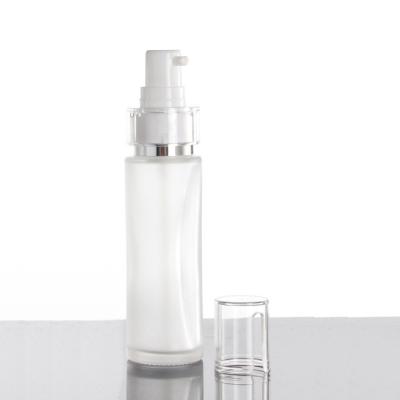 China Cosmetic Cosmetic Packaging 40ml Frosted Glass Lotion Bottle With Pump And Plastic Cap for sale