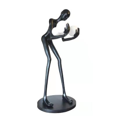 China Minimalist Zhongshan Factory direct sales Nordic style resin humanoid sculpture creative black floor lamp used in company lobby hotel lobby for sale